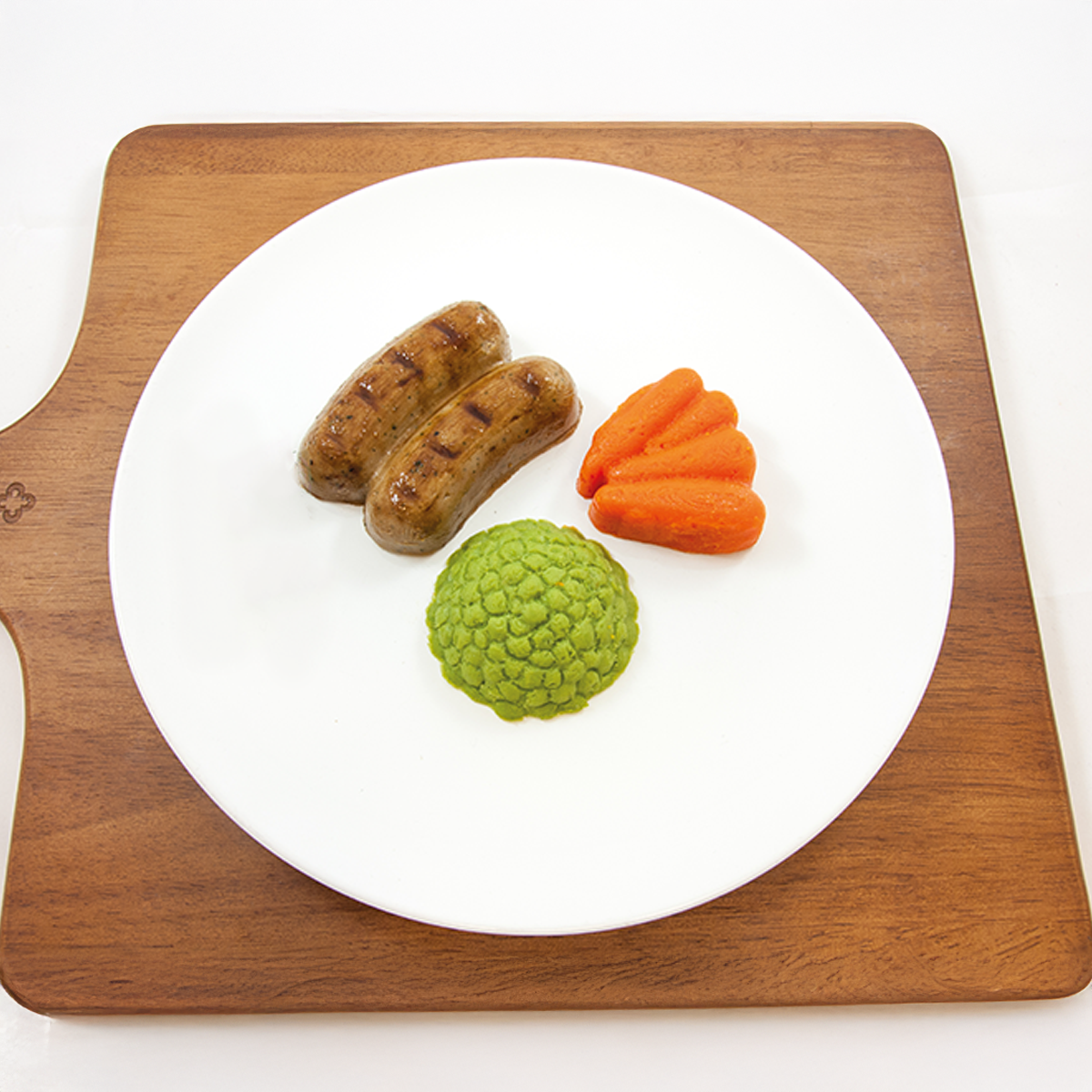 Shape It Pork, Herb and Honey Pureed Sausages with pureed Peas and Carrots